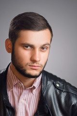 Casual young man studio portrait
