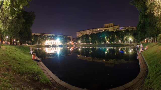 Time Lapse of Patriarch pond in Moscow at night. Still water.
