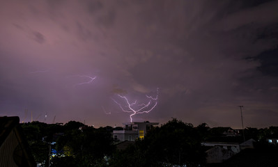 Silhuette of Thunderbolt over the buildings