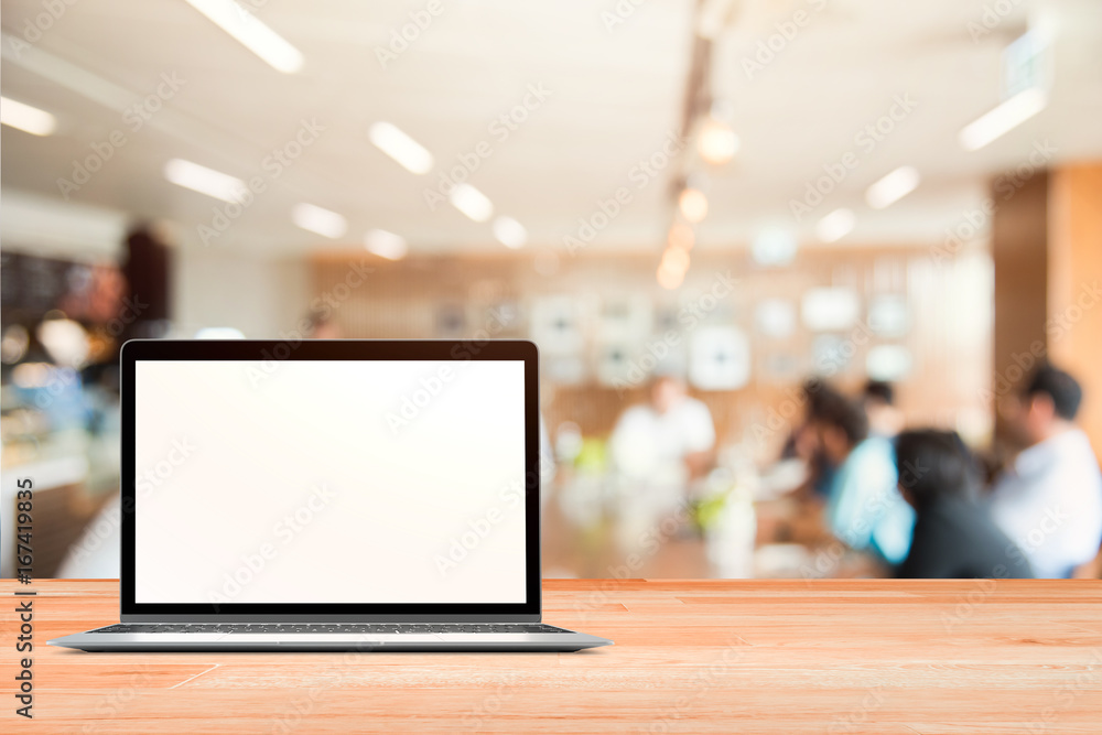 Poster laptop with blank screen placed on white wooden table in blurred people in blurred business metting 