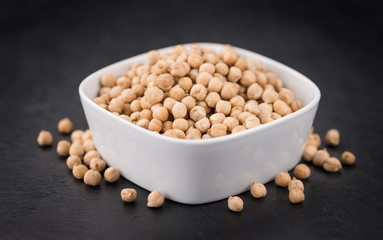 Rustic slate slab with dried Chickpeas, selective focus