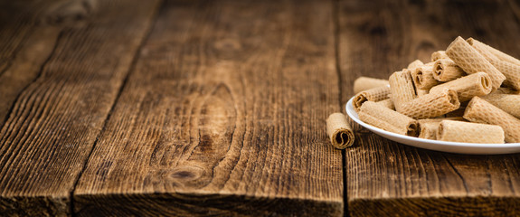 Portion of Sweet Wafers on wooden background, selective focus