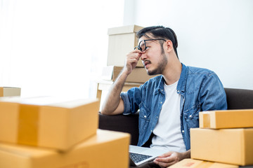 Young Asian Man Unsuccess for Work about Online Business or SME , Young Owner Man in Stress Situation, Man with Online Business or SME Concept.