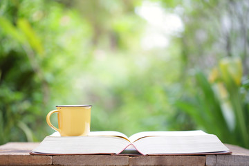 Yellow mug and notebooks