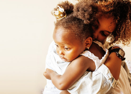 adorable sweet young afro-american mother with cute little daugh