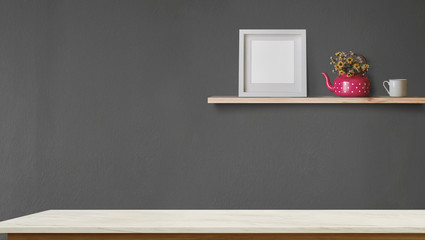 Empty marble table top and wood shelf with blank white frame and coffee. Blank screen and copy space for products or graphic montage.