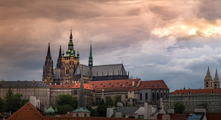 Prague Castle with cloudy sunset .
