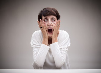 woman making the scream icon face