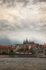 Obraz premium Vertical Prague Castle with cloudy sunset .