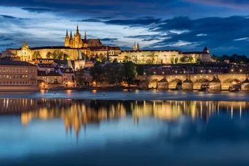 Foto op Canvas Prague Castle with cloudy sunset blue sky and Charles Bridge light up © nuinthesky