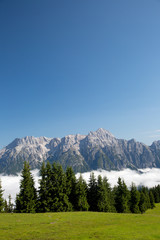 Fototapeta na wymiar Austrian alps salzburg leogang. Blue sky morning fog beautiful scenery austrian alps in summer