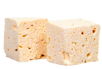 Sliced fresh white cheese from cow's milk on white background