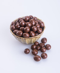 chocolate balls. chocolate balls in bowl on a background