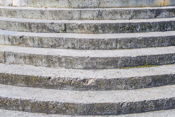 Background texture, old concrete staircase of semicircular shape
