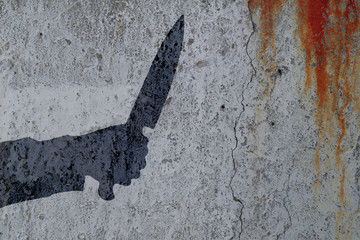 Shadow of human hand with killing knife on bloody wall background. Illustration for criminal news...