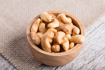 Roasted cashew nuts on rustic wood