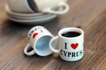 A couple of tiny souvenir cups for coffee, with an inscription "I LOVE CYPRUS"