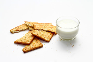A cracker is a baked food typically made from flour. Flavorings or seasonings, such as salt, herbs, seeds, and/or cheese, may be added to the dough or sprinkled on top before baking