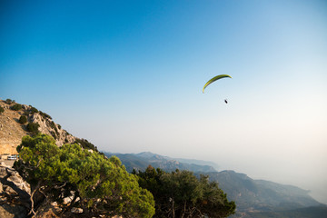 Paraglider flies near mount Babadag.