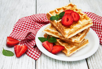belgian waffles with strawberries and mint