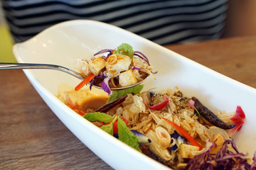 Pomelo salad thai style, mixed with purple cabbage, butterfly pea, torch ginger, chili and mint - Veganism Food is the practice of abstaining from the use of animal products.