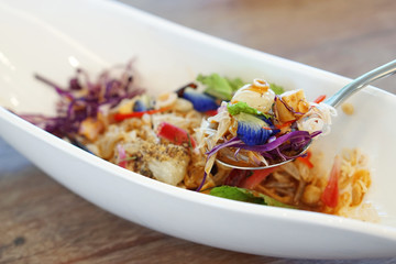 Pomelo salad thai style, mixed with purple cabbage, butterfly pea, torch ginger, chili and mint - Veganism Food is the practice of abstaining from the use of animal products.