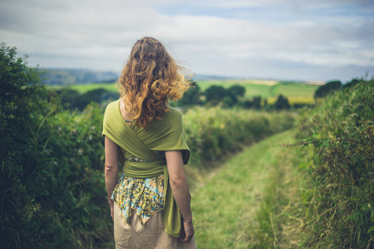 Young woman walking in countryside