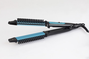 Blue hair straightener isolated