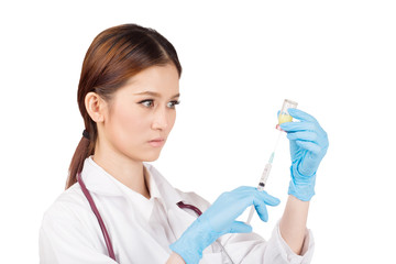 Syringe with vial  on hands in a latex glove of a female  doctor,administer the injection.
