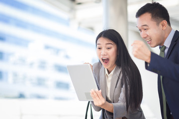 Two businesspeople showing their gladness, Successful work concept.
