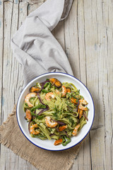 Green tagliatelle with seafood. Mussels; Prawns