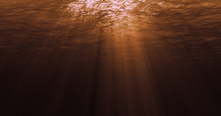 deep caribbean ocean waves from underwater background at golden sunset