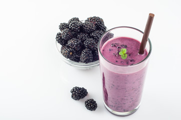 Fototapeta na wymiar Blackberry jogurt smoothie in glass and fresh berries series