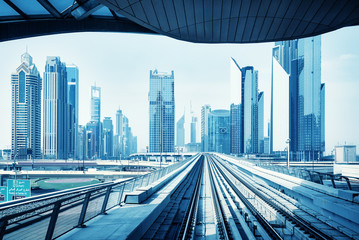 Futuristic Dubai skyline, blue color toning, United Arab Emirates.