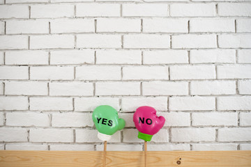 Image of colored boxing glove post with yes and no sign. Yes and no concept.