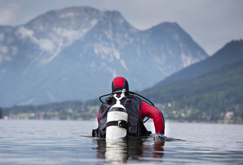 Diver walking in shallow water