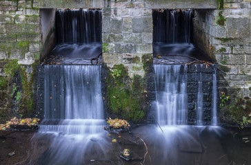 The waterfall out dam of city pond in Bueckeburg, Germany