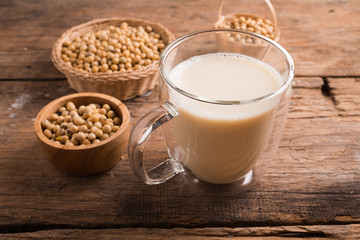 Glass with Soy Milk and Seeds on background