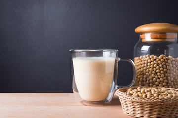 Glass with Soy Milk and Seeds on background