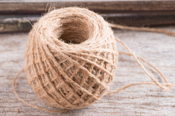 Hemp rope on wood background