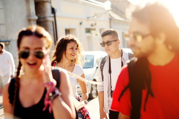 Group of beautiful tourists are enjoying summer in the city.