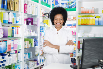 Confident Female Chemist Standing Arms Crossed