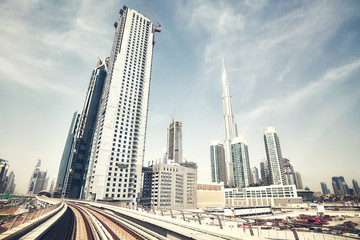 Fototapeta na wymiar Retro color toned wide angle view of Dubai skyline, United Arab Emirates.