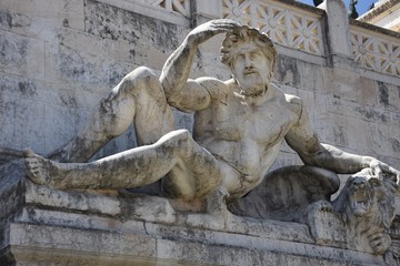 Fototapeta na wymiar Close up of a reclining male statue 