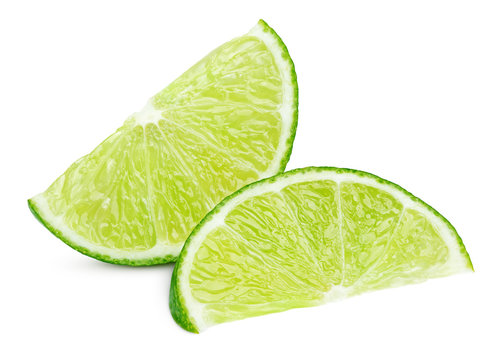 Two ripe slices of green lime citrus fruit isolated on white background with clipping path