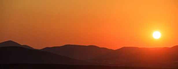 Fotobehang Zonsondergang Mountains landscape at sunset  © viperagp