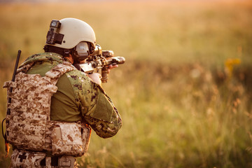 Infantry soldier shooting during military combat training.