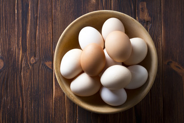 Eggs home made wooden plate Background vintage wood
