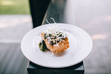 Chef finishing food in his restaurant kitchen
