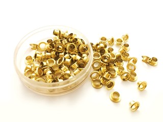 brass eyelets on white background